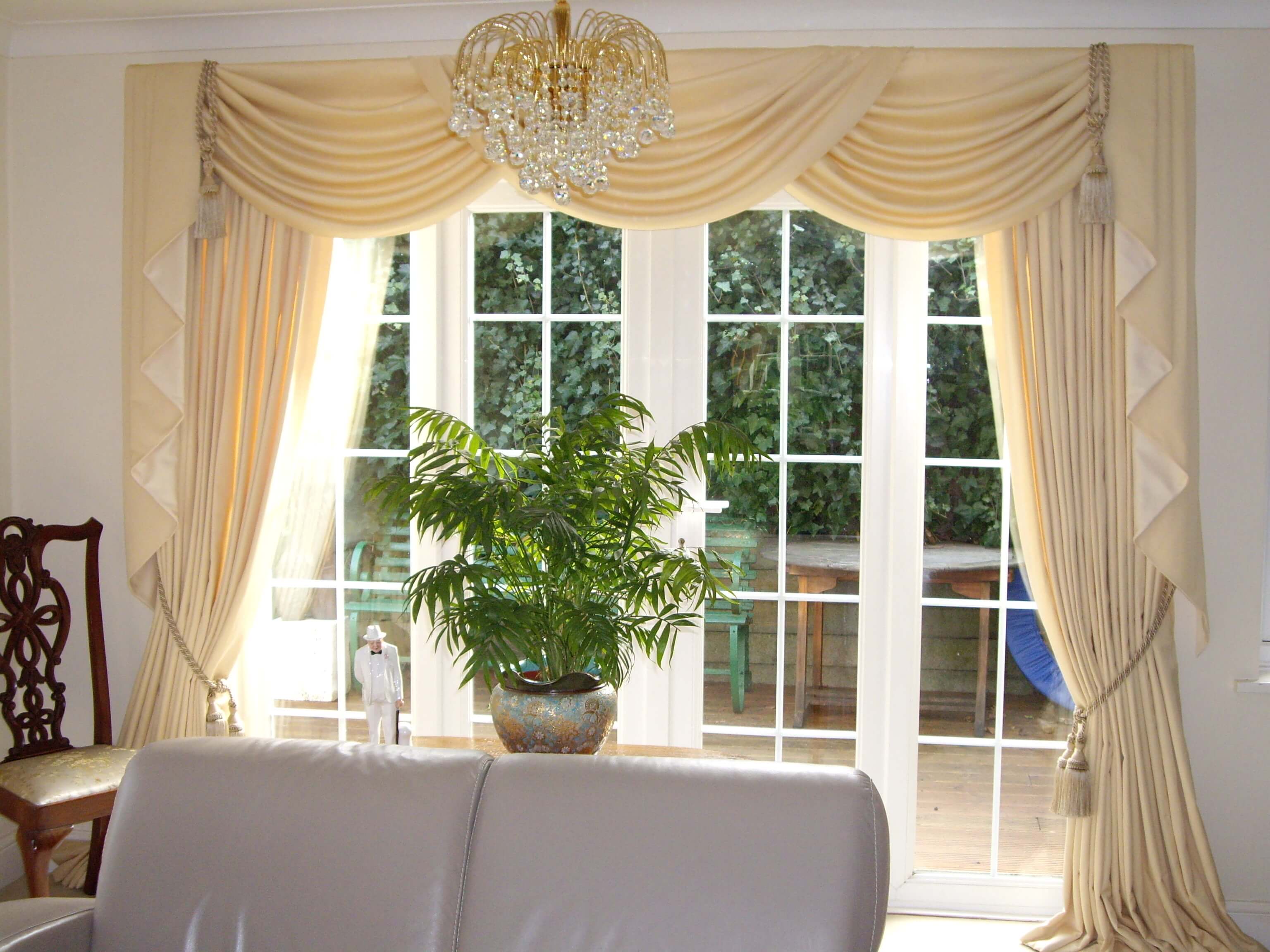 Cream curtains with swags and tiebacks