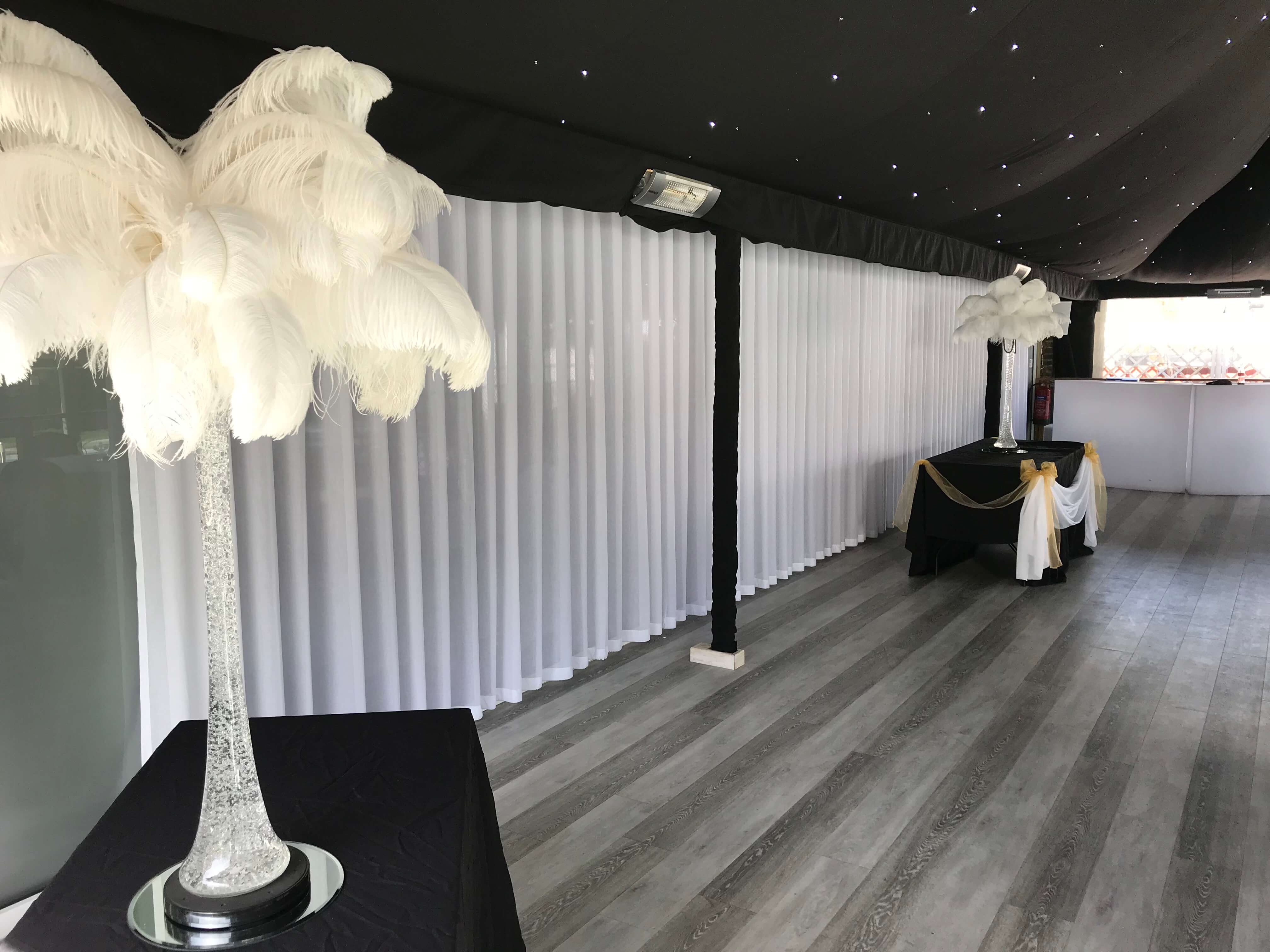 Bar with long white sheer wave curtain