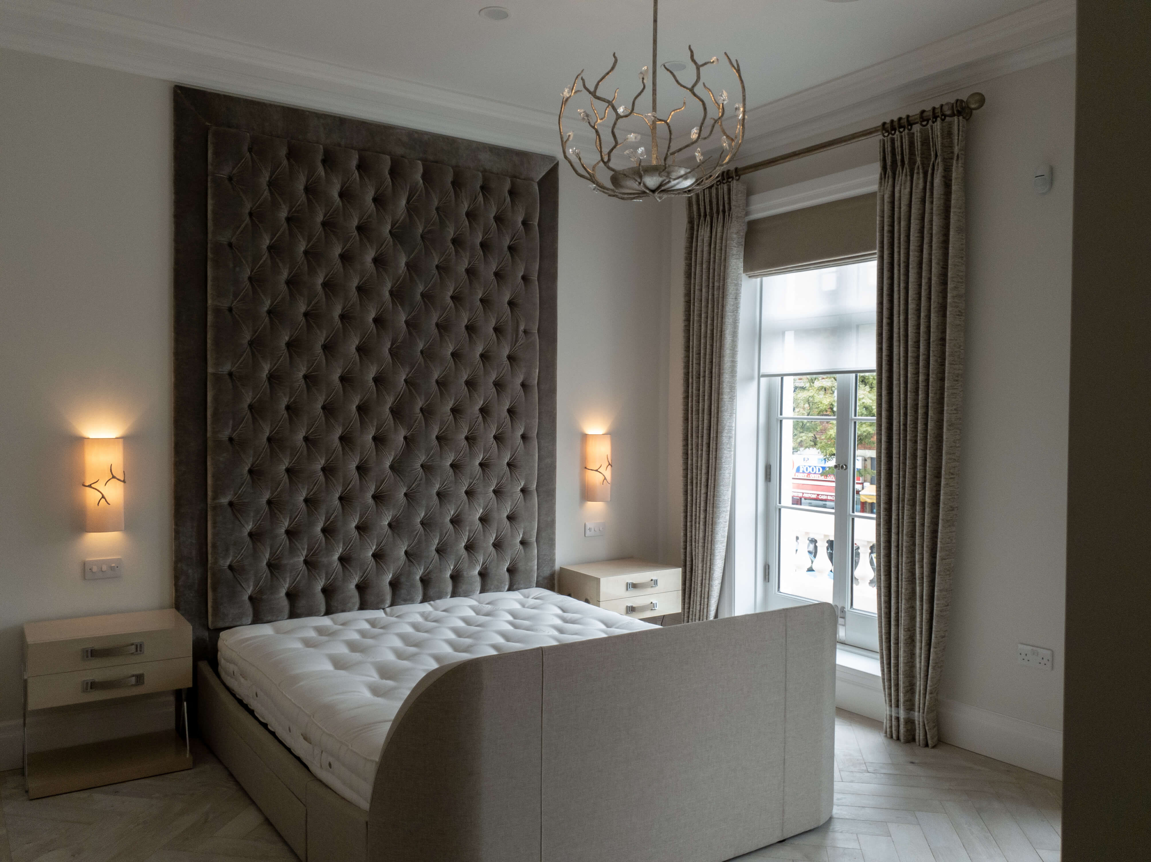Grey large headboard with roman blind, curtains on a pole and sheer roller blind