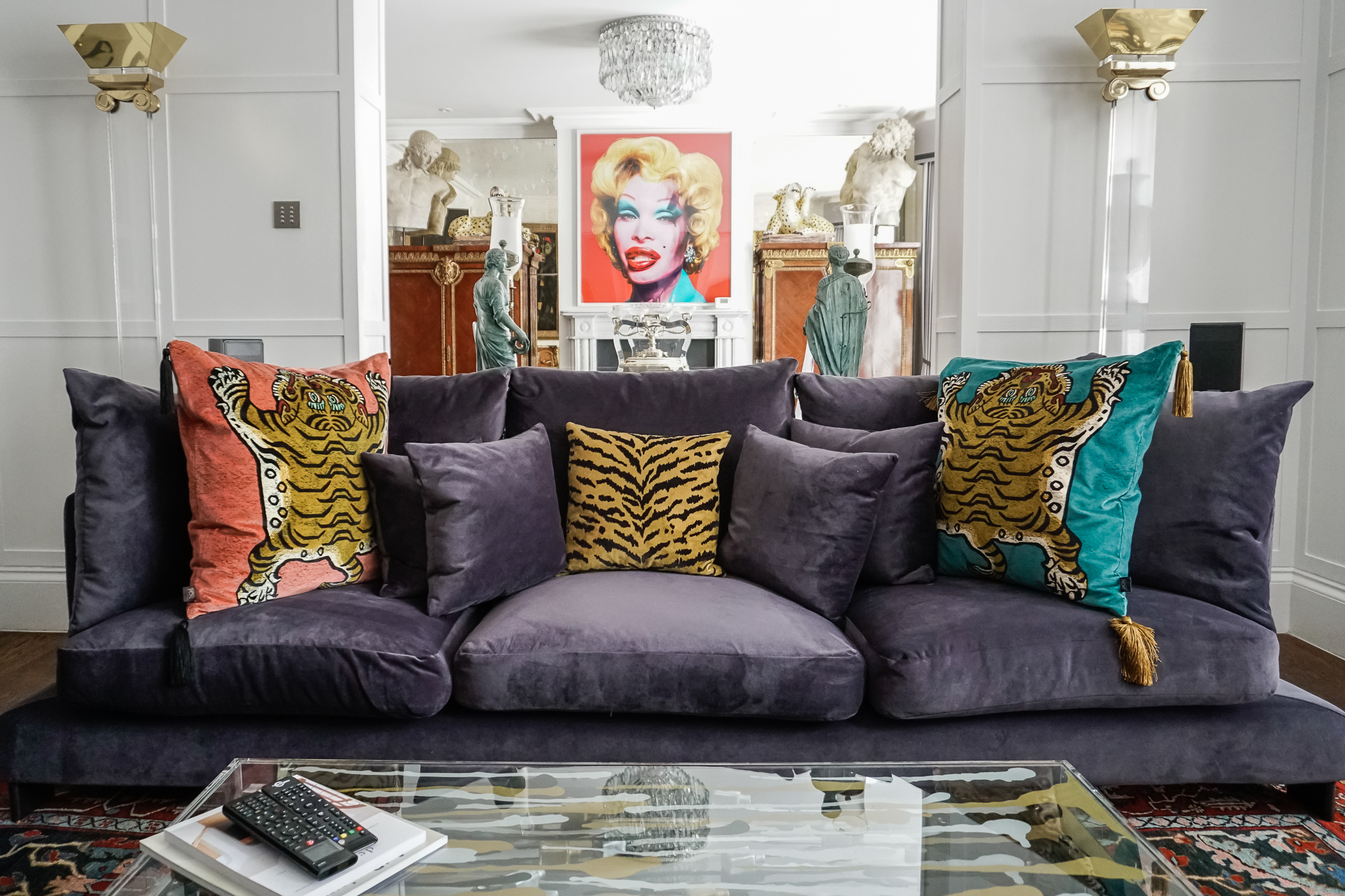 Re-covered purple sofa with tiger cushions